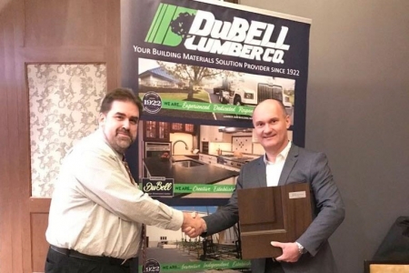 Glenview Doors Founder and CEO shakes hands with Dubell Lumber Marketing and Technology Manager Ed Evans